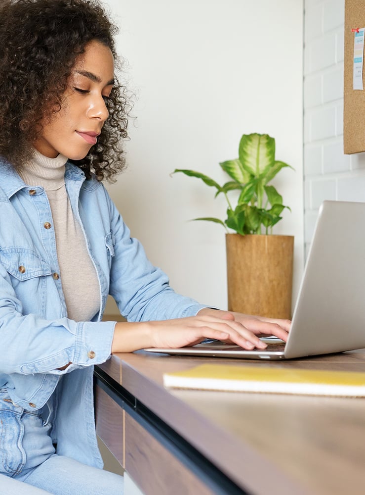 woman reading from computer